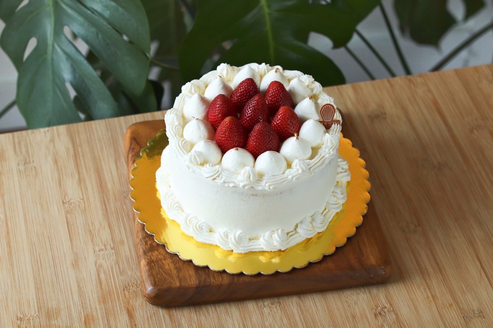 Takumi strawberry cream cake topped with fresh strawberries
